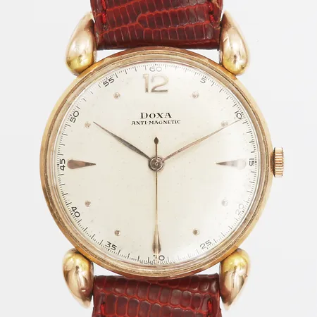 Herrur Doxa, Anti - Magnetic, manuell, Ø34mm, serie-nr: 854662,  läderarmband, spänne i gulmetall, smärre bruksslitage, boett i 14K guld, bruttovikt: 35,8g. 