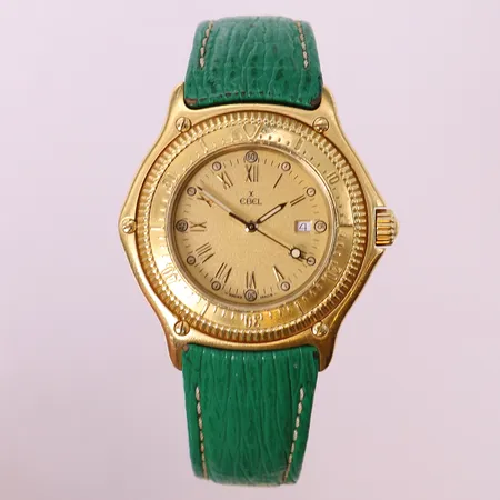 Herrur, Ebel Discovery Divers 200m, 18K, ca Ø38mm, datum, quartz, refnr: 833913, snr: 407, grönt läderband med 18K lås, certifikat Berggren Stockholm 1988, kvitto Kaplans 2023, inga övriga tillbehör