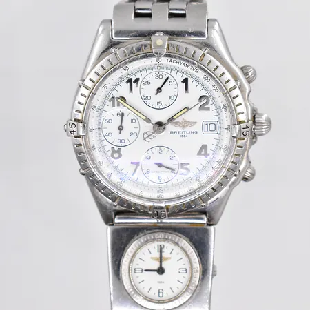 Herrur Breitling Chronomat,  modell A13050, automatisk, Ø 39mm, vit urtavla, UTC A61072,  stål, pilotlänk, innermått  ca 19 cm, trög ring, slitage, behov av service, inga tillbehör