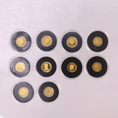 Tio samlarmynt, olika motiv, Ø11mm, etui,  24K.  Vikt: 5 g