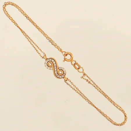 Armband, integrerat hänge, vita stenar, längd ca 18,5cm, bredd 6,3mm, saknar en sten, 21K  Vikt: 2,5 g