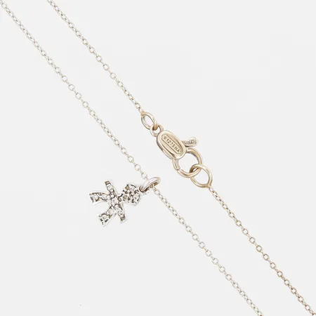 Kedja med integrerat hänge i form av en gubbe med diamanter 10 x ca 0,005ct, längd: 45,5 - 57,5, bredd: 1 - 10 mm, 18K guld. Vikt: 2,1 g