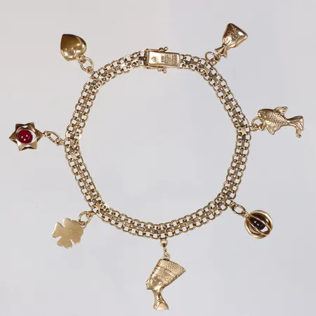 Armband X-länk 18,5cm bredd 5mm med 7 Berlocker (delvis med stenar, samt defekter) 18K Vikt: 12,5 g
