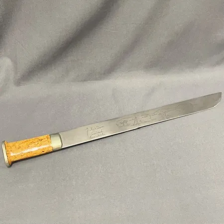Samekniv, J.Marttiini Finland, graverad, slida av läder, längd ca 60cm. 