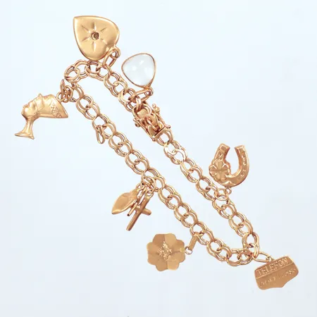 Armband Bismarck, 7st berlocker några buckliga, , år 1963, Brofod Aktiebolaget, 18K  Vikt: 11,1 g