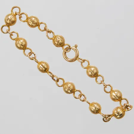 Armband, längd ca 16,5cm, bredd 1-5,5mm, ostämplad, 18K Vikt: 6,7 g