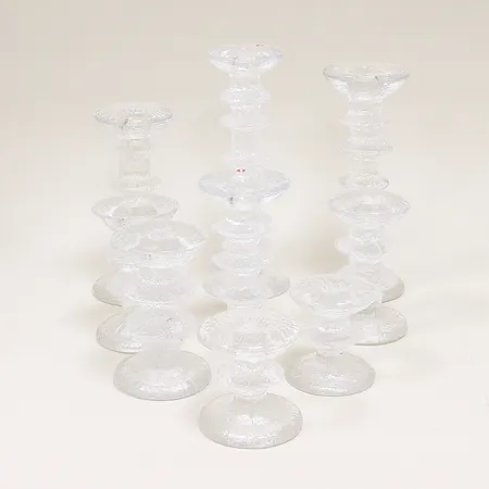9 ljusstakar Iittala "Festivo" Timo Sarpaneva, 3x ca 12,5cm, 2x ca 8cm, 1x ca 14,5cm, 1x ca 18cm, 1x ca 22cm, 1x ca 24cm. Skickas med postpaket.
