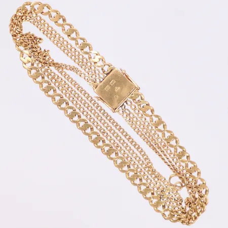 Armband 4-radigt, längd 19cm, bredd 10mm, monogram på lås, slitna länkdelar, 18K Vikt: 13,3 g
