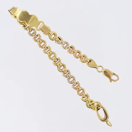 Armband, längd 19,5cm, bredd 6-9mm, ocentrerat, ihåligt, tvåfärgat 18K.  Vikt: 9,3 g
