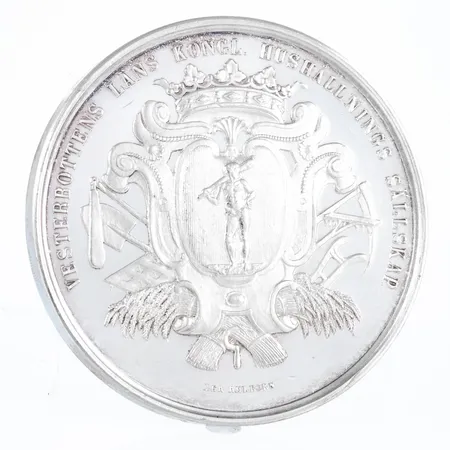 Medalj i silver Ø 51,5 mm. "ARBETE MED OMTANKA BEREDER VÄLSTÅND", VESTERBOTTENS LÄNS KONGL. HUSHÅLLNINGS SÄLLSKAP". Myntgravör: Lea Ahlborn. Vikt: 67,2g.