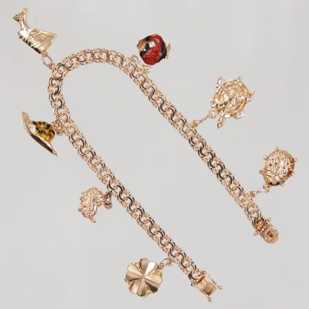 Armband Bismarck med 7 berlocker, 19cm, bredd 5mm, 18K Vikt: 16,9 g