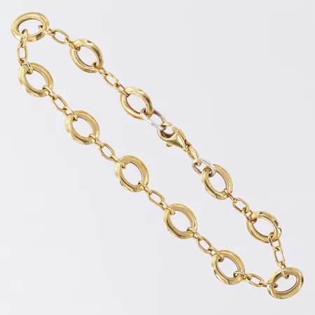 Armband, längd 16,5cm, bredd 2,7-7mm, lagning/låsöglor i silver, 18K.  Vikt: 3,1 g
