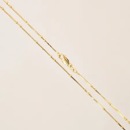 Kedja med integrerade kulor, längd 46,5cm, bredd 0,7-1,8mm, 18K Vikt: 4,3 g