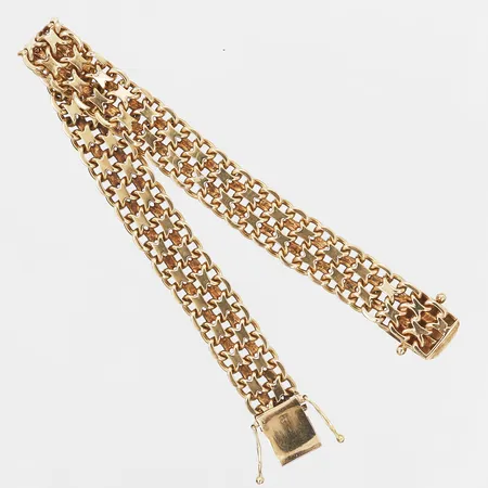 Armband, X-länk, Årsta Guldsmedsverkstad, Stockholm år 1965, längd: 18,5cm, bredd: 10 mm, 18K guld. Vikt: 26,6 g