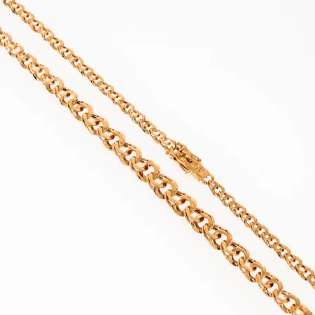 Colliér, doserad spetsslipad Bismarck  i 18K guld. Det är 43,5 cm långt, 3,9 - 7 mm brett och väger 14,2g. Kistlås.