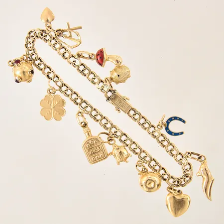 Armband Bismarck med elva berlocker, längd 19,5cm, bredd 5mm, 18K Vikt: 18,6 g