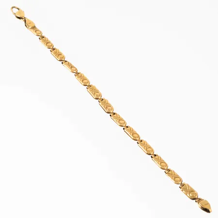 Armband i 18K guld. Det är 18,5 cm långt, 5 mm brett och väger 8,3g. Karbinhake. Ihålig. Skev i länkarna. 