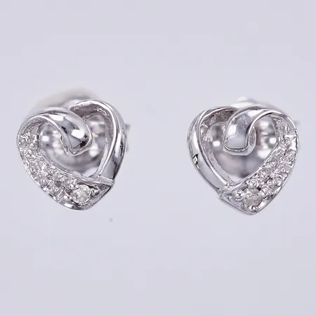 Ett par örhängen hjärtan med diamanter 2 x ca 0,01ct, Ø ca 6mm, 18K  Vikt: 1,1 g