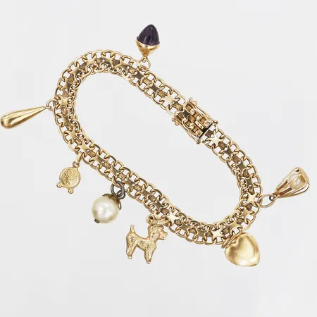 Armband, X-länk, med berlocker 7st berlocker, en berlock ej guld, längd 18cm, 18K guld Vikt: 19,4 g