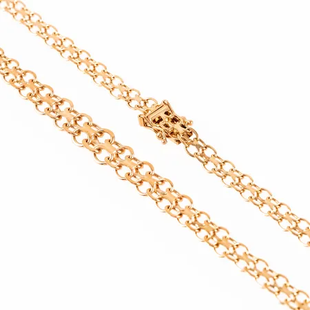 Doserad X-länk i 18K guld. Det är 44 cm långt, är 4,8 - 7,3 mm brett och väger 12,4g. Stämplad A10, ÄSA, 18K & kattfot. Gravyr på låstunga.