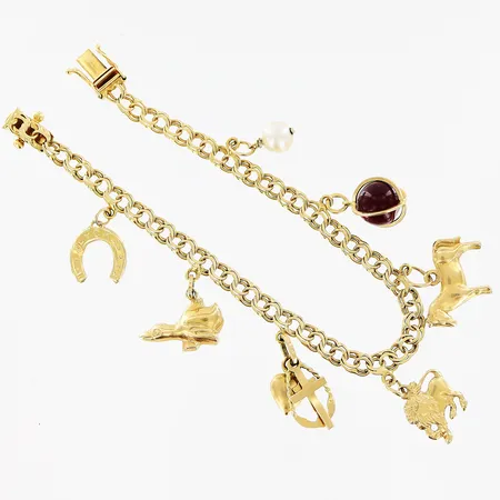 Armband Bismarck 16,5cm, bredd 4mm, 7 berlocker, slitage/skevheter på både länk och berlocker, 18K Vikt: 10,5 g