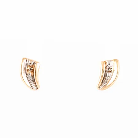 Örhängen i 18K guld med 2 x ca 0,005ct åttkantslipade diamanter. Mått 5,9 x 10 mm. Vikt: 1,0g. Omaka snurrebussar. 
