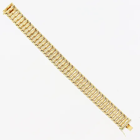 Armband, 19cm, bredd 15mm, slappt lås, 18K.  Vikt: 28 g