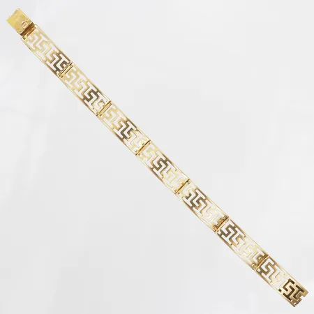 Armband, med dekor av meanderbård, längd 19cm, bredd 10mm, 18K guld Vikt: 17,5 g