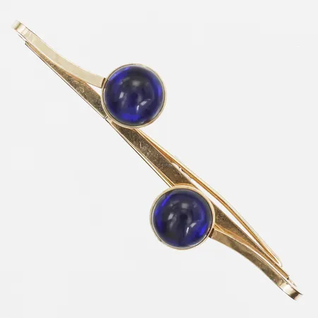 Slipsklämma med blått glas, längd 70mm, bredd ca 20mm, 18K guld, bruttovikt: 6,3gr Vikt: 6,3 g