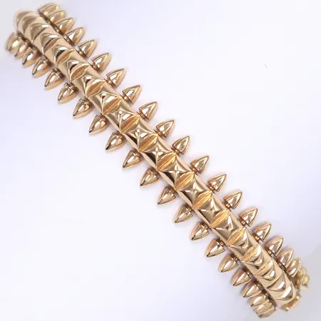 Armring, öppningsbar, innermått ca 54x47mm, bredd 10mm, utländska stämplar, 18K Vikt: 13 g