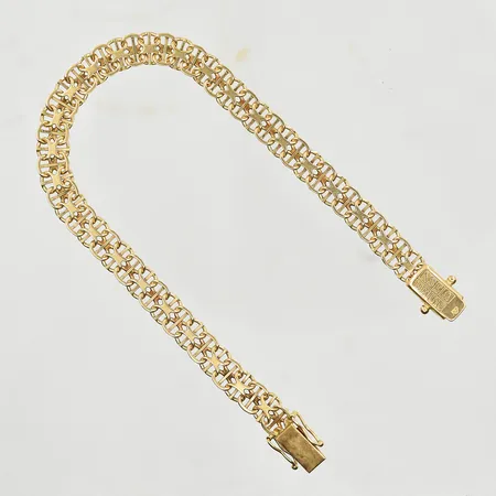 Armband X-länk med stav, längd 19½ cm, bredd 6 mm, 18K. Vikt: 11,7 g