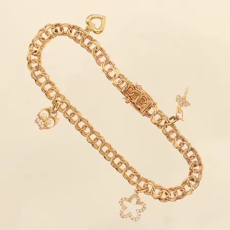Armband Bismarck med fyra berlocker, längd 18cm, bredd 5,1mm, skadade berlocker, stenar saknas, 18K  Vikt: 10,3 g