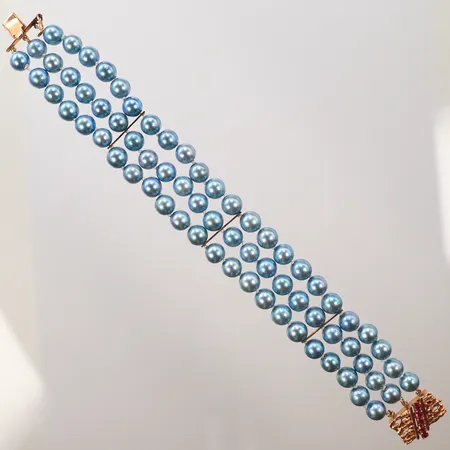 Armband med blå pärlor, samt röda stenar, längd 20cm, bredd 20mm, (guldvikt ca 4g) 14K, bruttovikt 41,1g