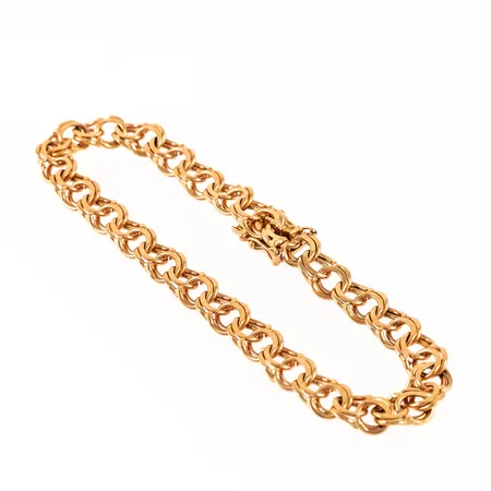 Armband Bismarck i 18K guld. Det är 19 cm långt, 6,5 mm brett och väger 13,9g. Kistlås. Stämplat Q9 (1966), GSK (G S K Present AB, Edsbyn), 18K & kattfot. 