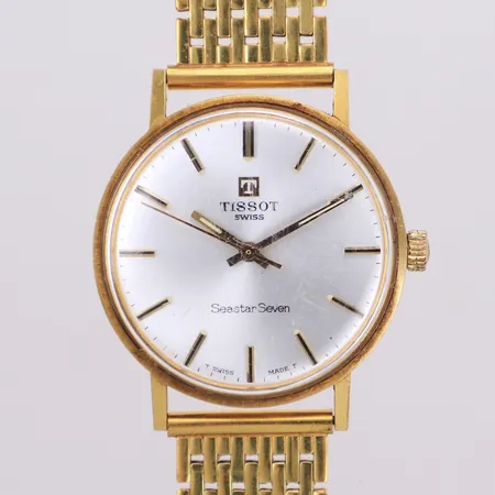 Herrur Tissot Seastar Seven 18K, manuell, Ø 33mm, korridor länk i förgylld stål, repig, gravyr, inga övriga tillbehör, 18K bruttovikt: 61,7g