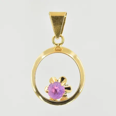 Hänge med lila sten, längd 23 mm, bredd 14 mm, 18K. Vikt: 1 g