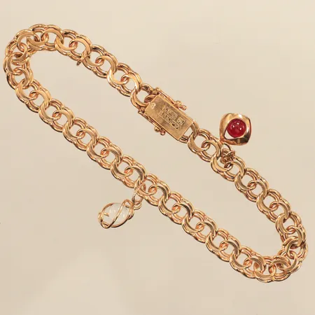 Armband Bismarck med två berlocker ca 20cm, bredd ca 7mm, en berlock saknas, 18K Vikt: 18,9 g