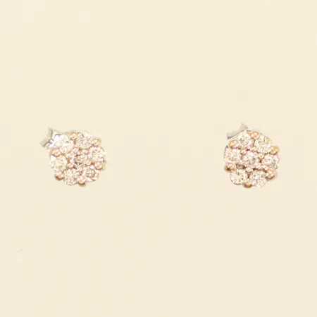 Ett par örhängen, diamanter 14xca0,01ct, Ø5,1mm, vitguld, ett stift något skevt, 18K Vikt: 1 g