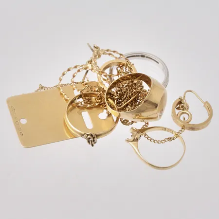 Diverse defekt guld, 18K, vikt 26,49g.