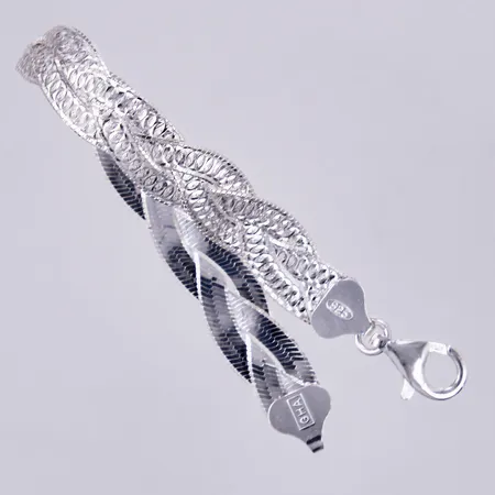 Armband fältat, längd: ca 17cm, bredd: ca 10mm, GHA, 925/1000 silver  Vikt: 10,6 g