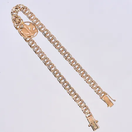 Armband Bismarck med en berlock, längd 19,5 cm, bredd 5 mm, 18K. Vikt: 11 g