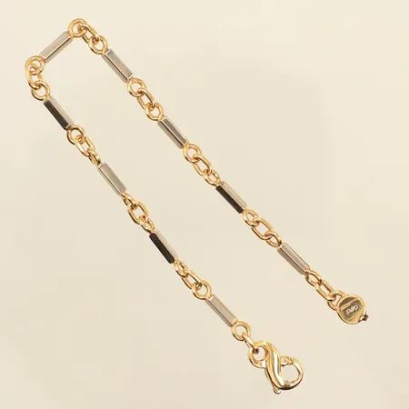 Armband, längd 19,5cm, bredd 2,1-4,1mm, tvåfärgat, 18K Vikt: 12,6 g