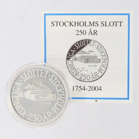 Mynt 200 Kronor - 250 år Kungliga slottet Stockholm 1754-2004, Ø36mm, etui, Silver 925/1000.  Vikt: 27,1 g