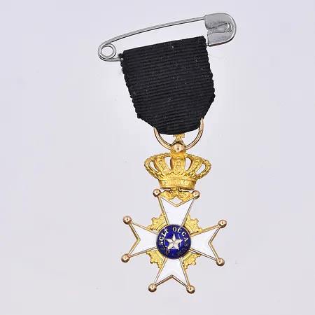Medalj, miniatyr nordstjärnan, längd 35 mm, bredd 20 mm, 18K.  Vikt: 3,3 g