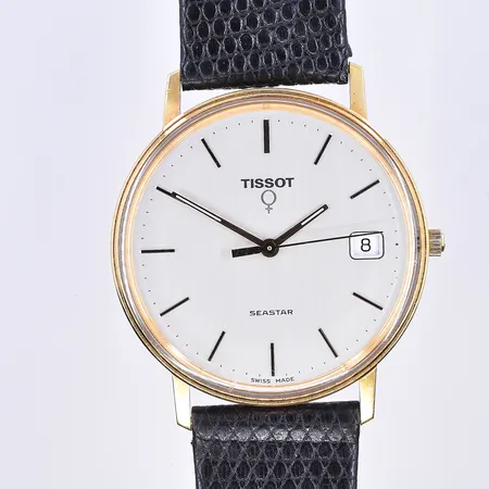 Herrur Tissot Seastar, quartz, datum, Ø33 mm, garverad boett, fungerar ej vid testtillfället, svart läderband, etui medföljer, 18K. Bruttovikt 28,9g.