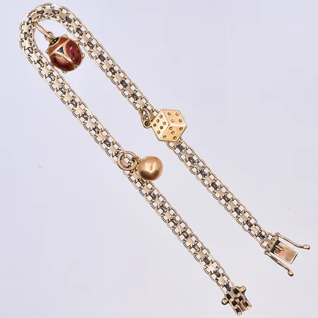 Armband X-länk med berlocker, längd 19,5 cm, bredd länk 4 mm, 18K. Vikt: 7,6 g