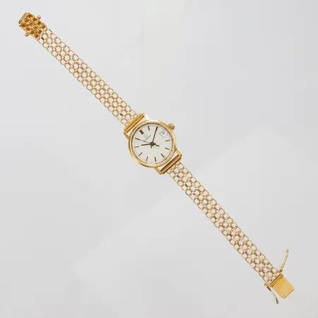 Damur, Eterna 18K, Ø22mm, quartz, går ej, X-länksarmband 18K, längd inklusive ur: 16,5cm, personlig gravyr, brv: 16,4g. 