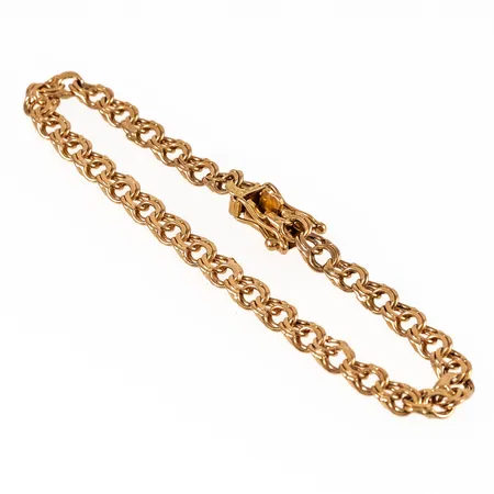 Armband, Bismarck i 18K guld. Det är 18 cm långt, 5 mm brett och väger 8,1g. Kistlås. 18K & kattfot. Ojämnheter. 