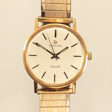 Armbandsur, Certina New Art, 18K, Ø33mm, manuell, defekt, går ej, gravyr, flexarmband i metall, bruttovikt 56g