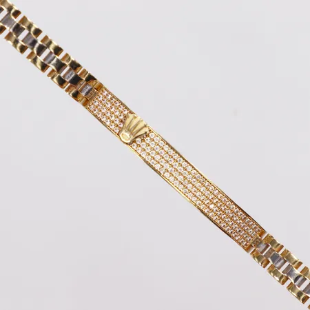 Armband, halv stelt, öppningsbar, inre mått 58,6x47,3mm ca 16,6cm, bredd 6,3mm, vita stenar, gravyr på låset, OBS Ej märkesdesign, 18K  Vikt: 19 g